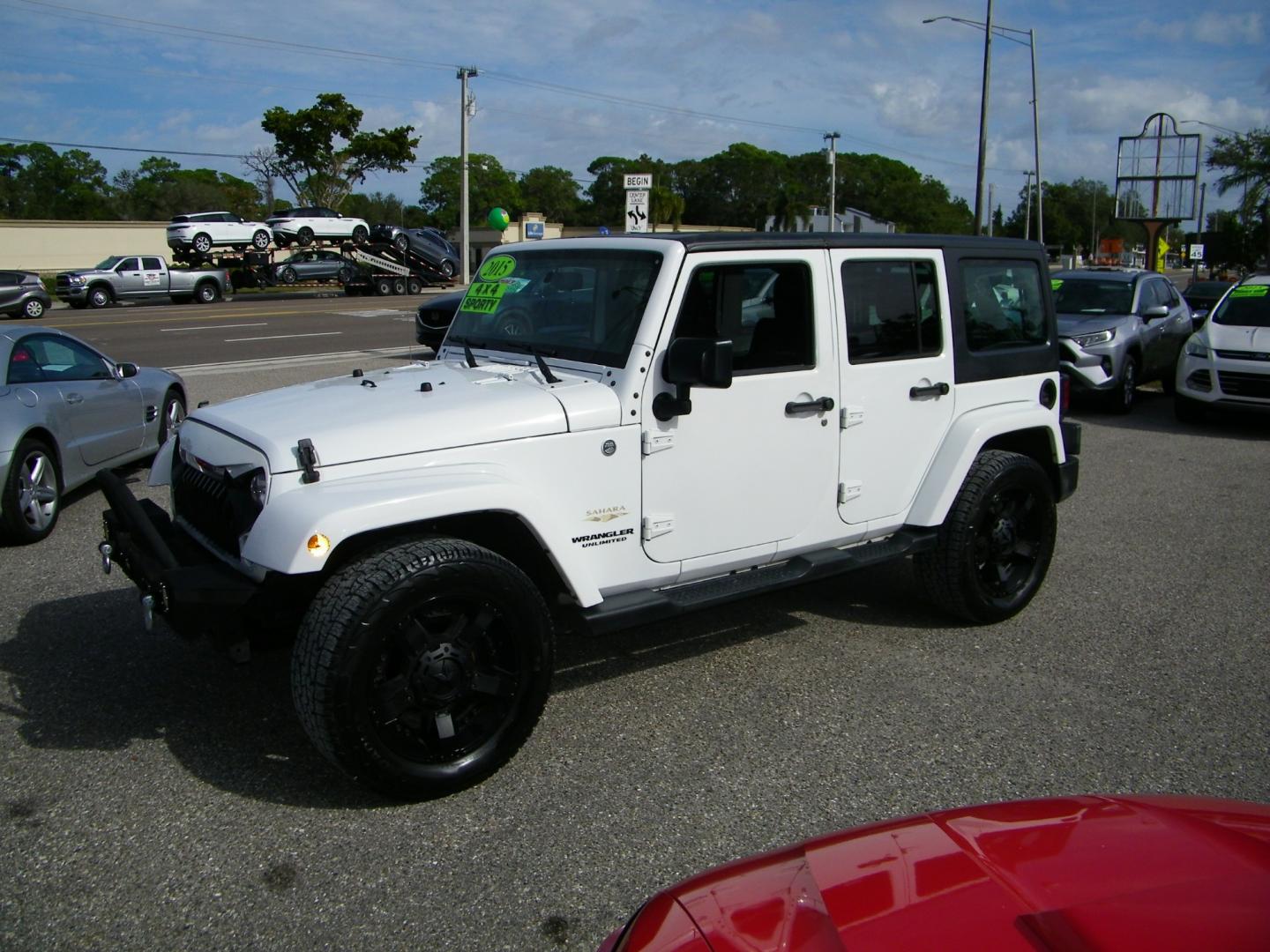 2015 White /Black Jeep Wrangler Unlimited Sahara 4WD (1C4BJWEGXFL) with an 3.6L V6 DOHC 24V FFV engine, Automatic transmission, located at 4000 Bee Ridge Road, Sarasota, FL, 34233, (941) 926-0300, 27.298664, -82.489151 - Photo#0